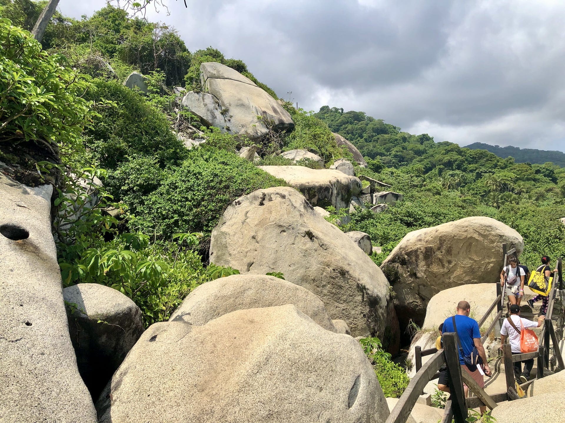 Tayrona National Park, Colombia Large boulders line the hiking path near Playa Cañaveral, with steps to help navigate between them.