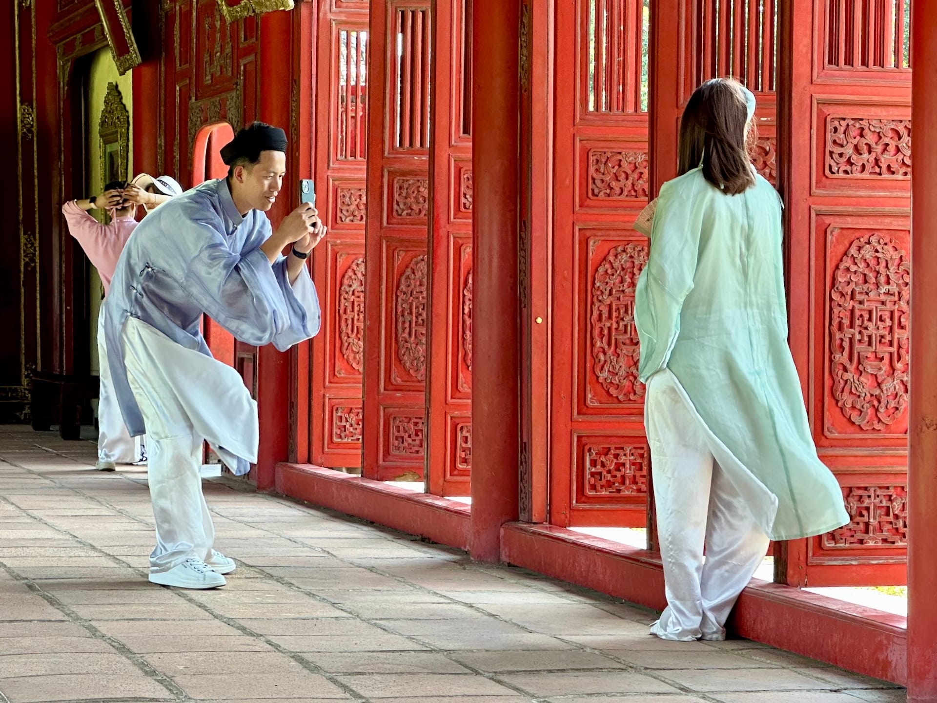 Hue, Vietnam Locals love to dress up in traditional Vietnamese clothes at historic places.
