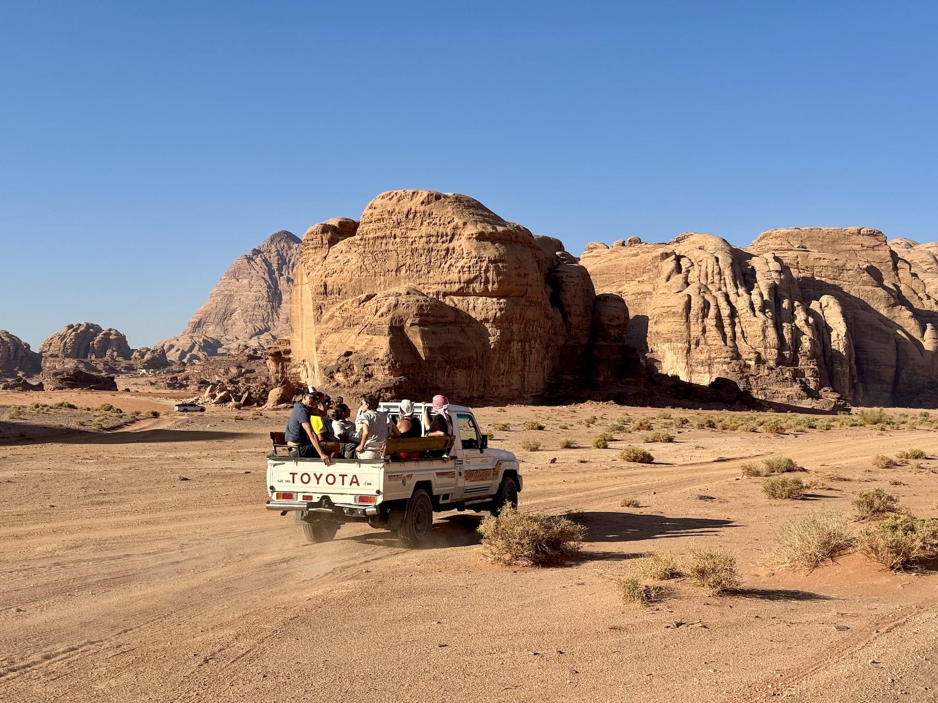 Wadi Rum, Jordan A truck crossing the Wadi Rum desert in Jordan.