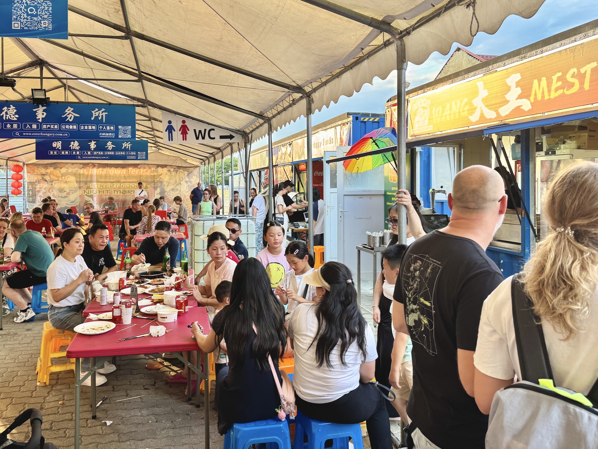 Budapest Chinatown Night Market Food stalls line the area beside the main tent at Budapest's Chinese Night Market.