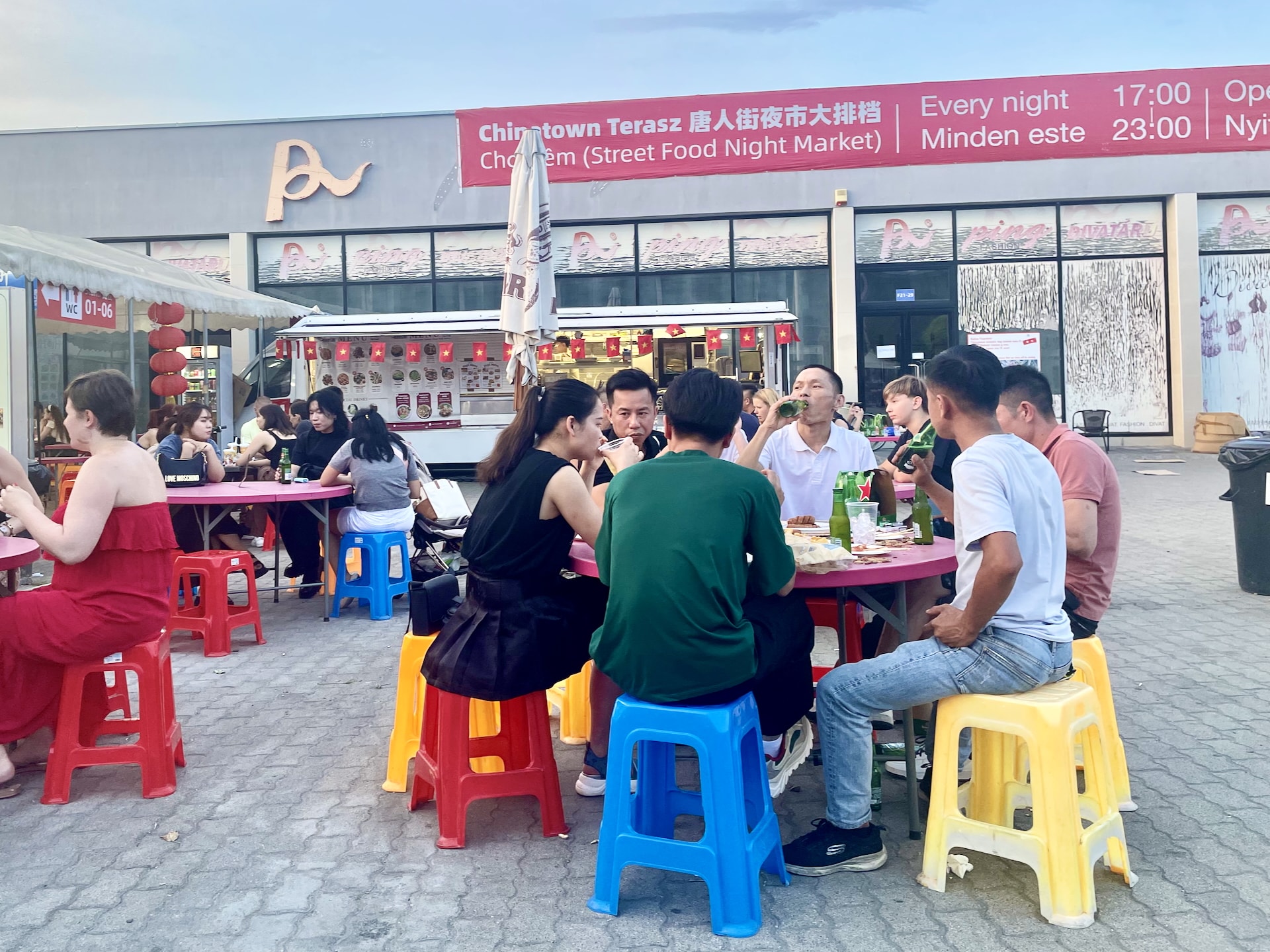 Budapest Chinatown Night Market Seating outside the tents becomes more comfortable after sunset when temperatures drop.