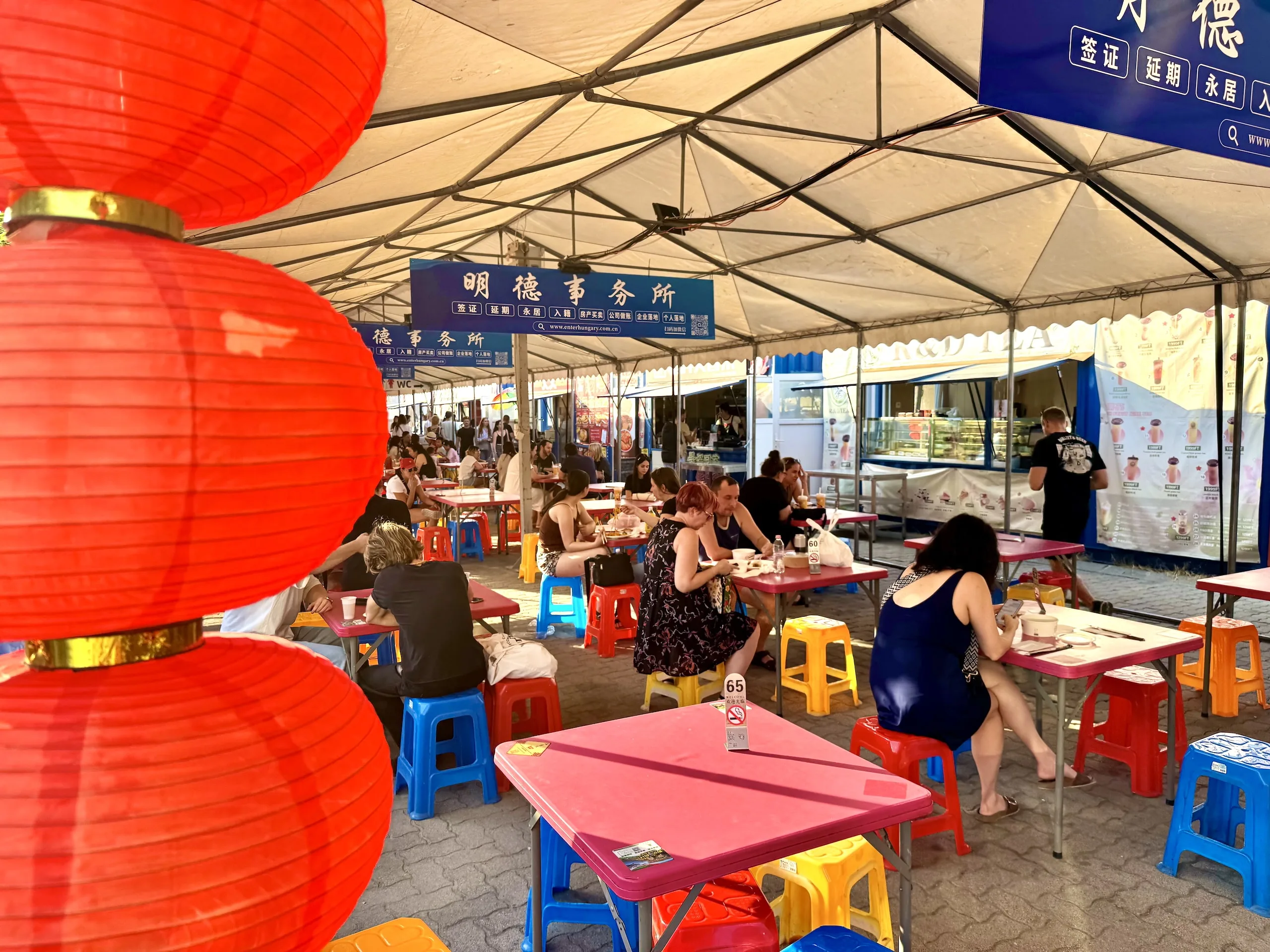 Dining tables at Budapest's Chinese night market under the main tent
