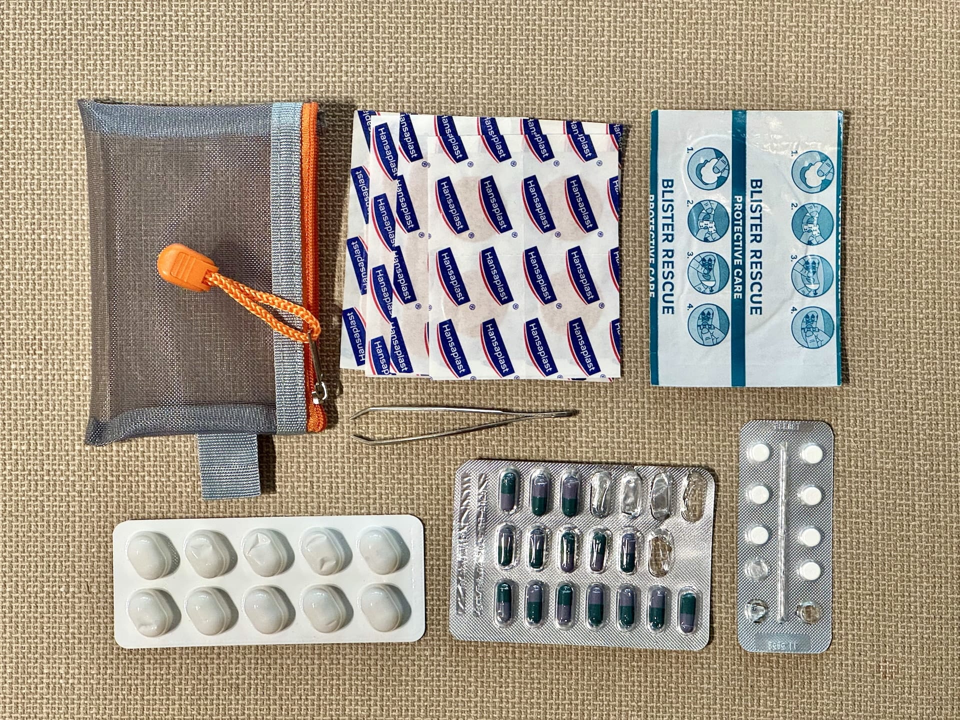 Travel Health Kit The contents of my minimalist travel medicine and first aid kit, and the pouch I keep them in.