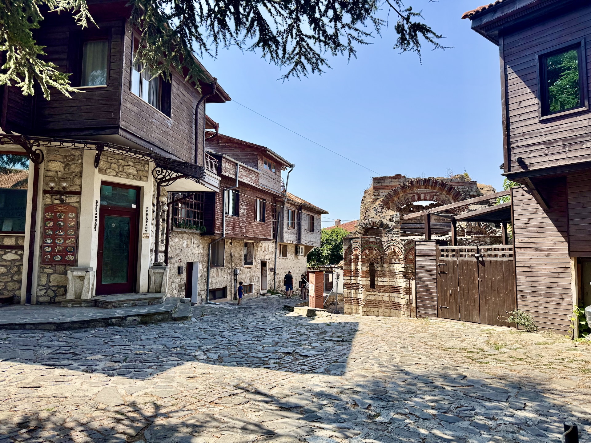 Nesebar, Bulgaria The old town of Nesebar with traditional houses and the ruins of a Byzantine-style church.