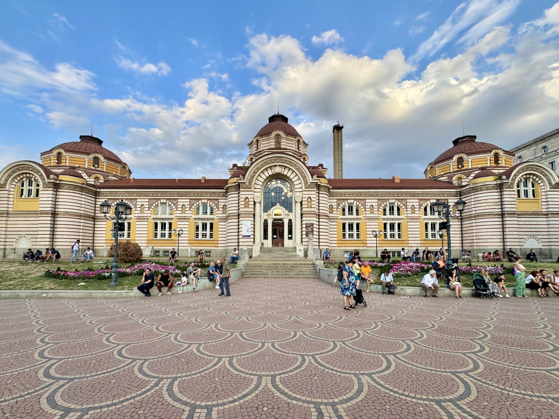 Sofia, Bulgaria When we went back one afternoon, many locals were happily dancing the local folk dance in front of the bathhouse building.