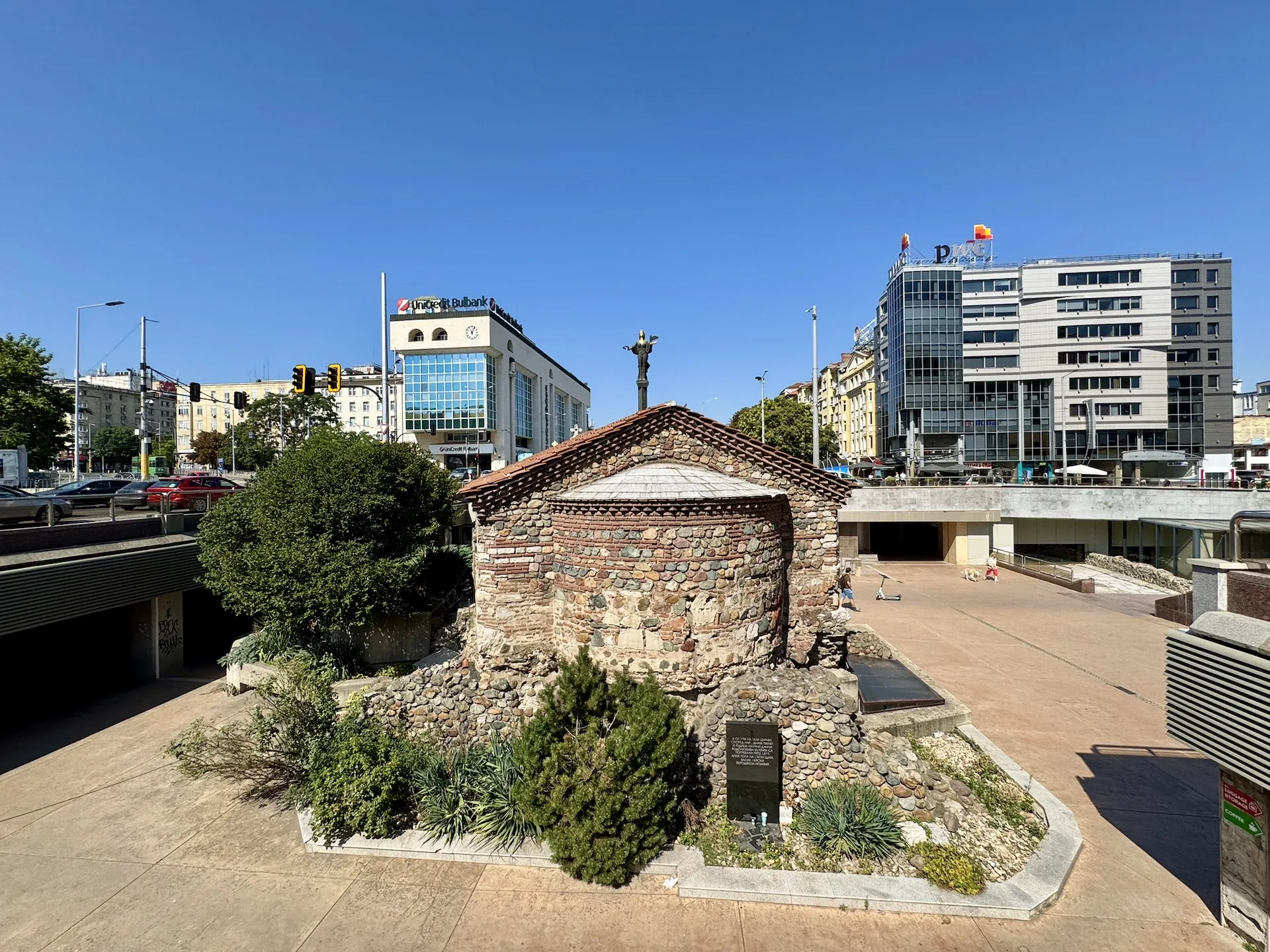 St. Petka, the tiny Orthodox church below the current level of the city, with a statue of Sofia in the background.