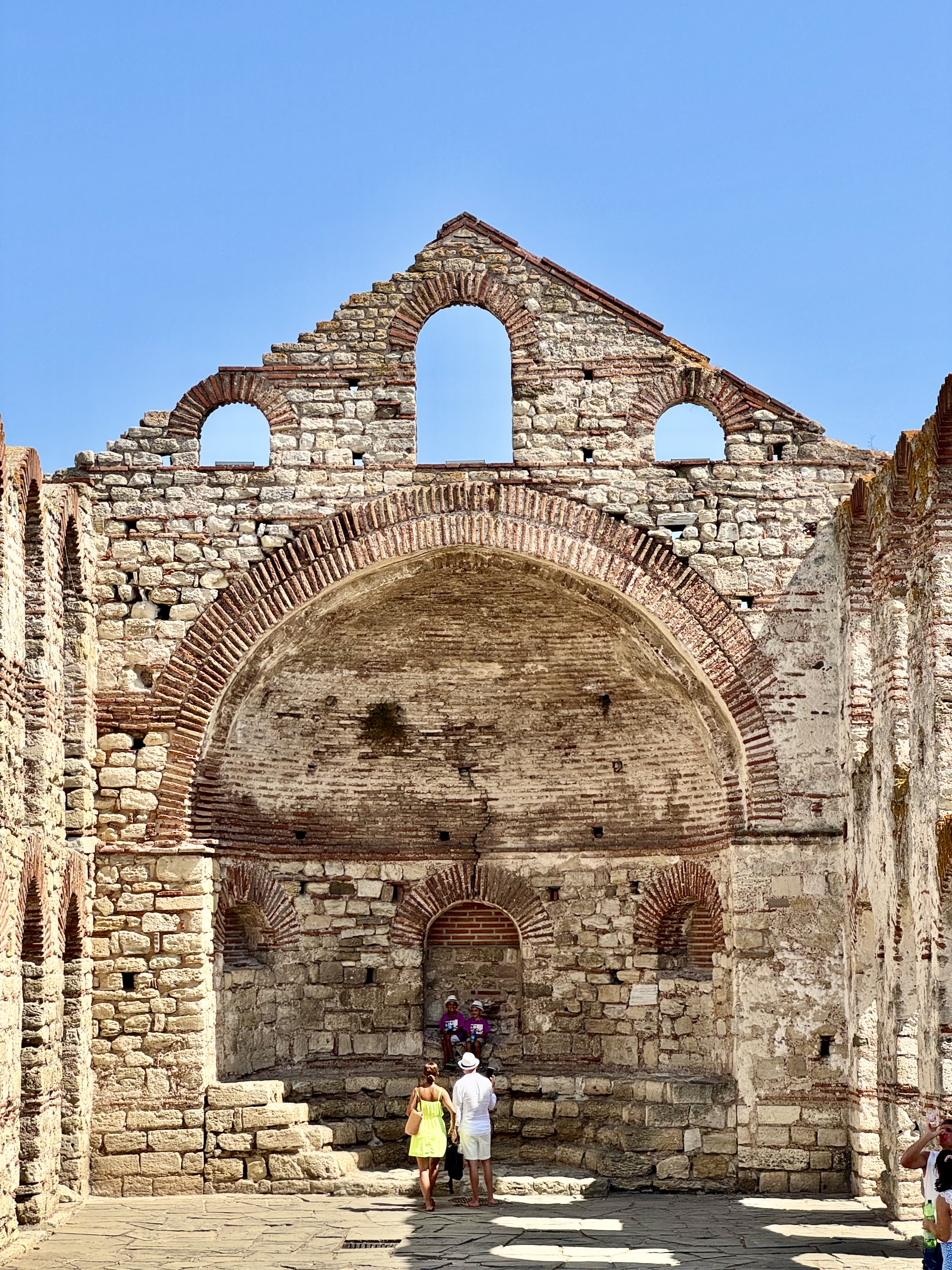 Two visitors at St Sofia Church, where the altar once stood.