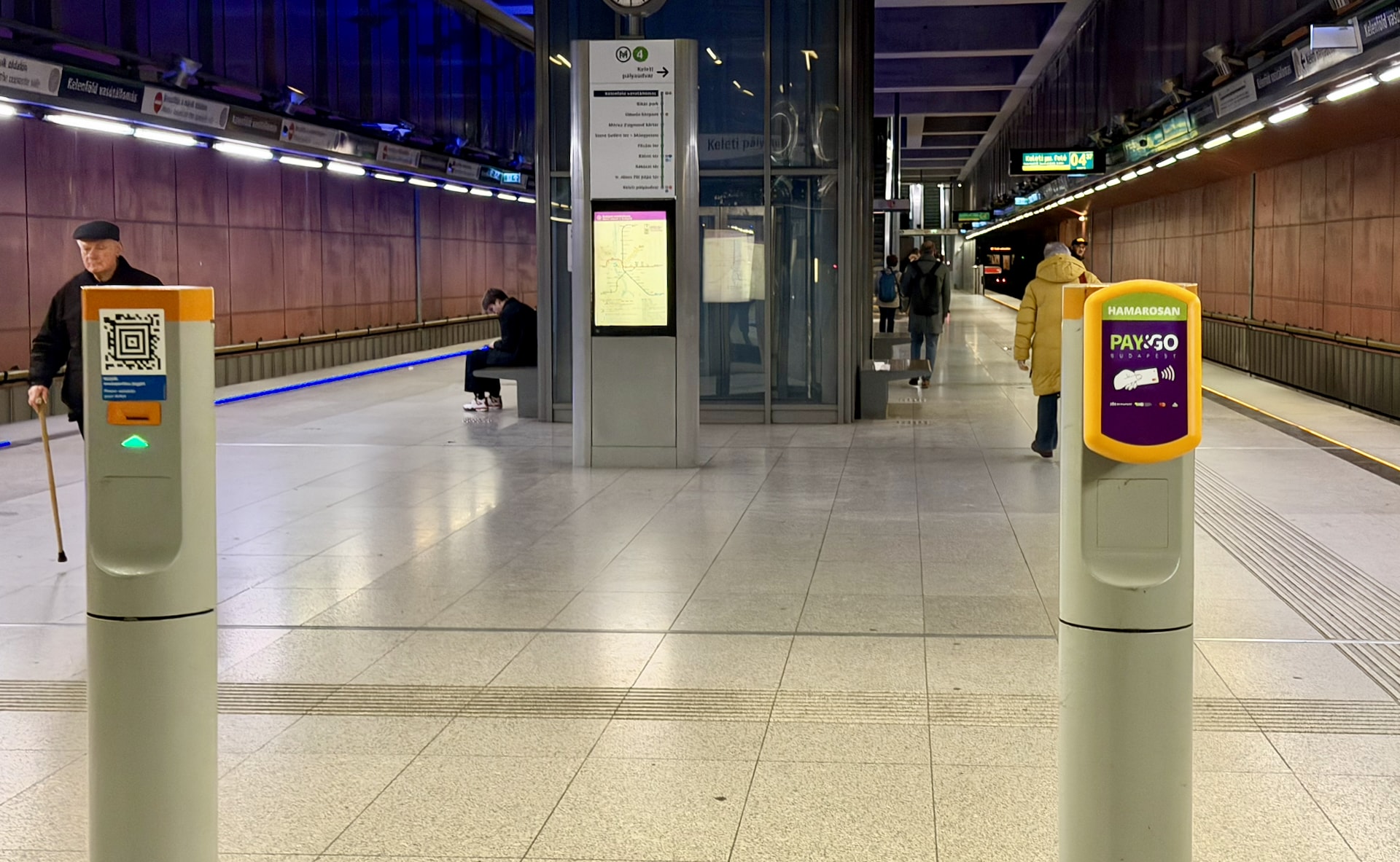 Metro entrance with a ticket validator column and QR code, plus the Pay&GO terminal – still showing "COMING SOON" for now.