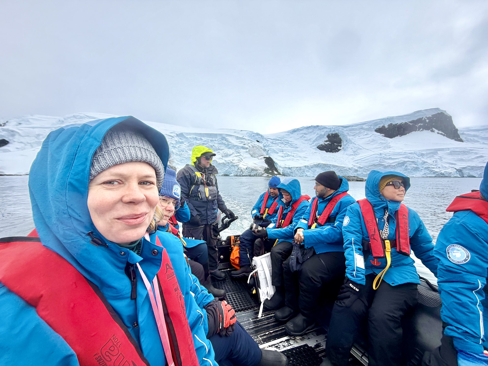 Mid-Zodiac cruise. At the helm is Justin, one of the expedition guides, who's been exploring the world for 25 years