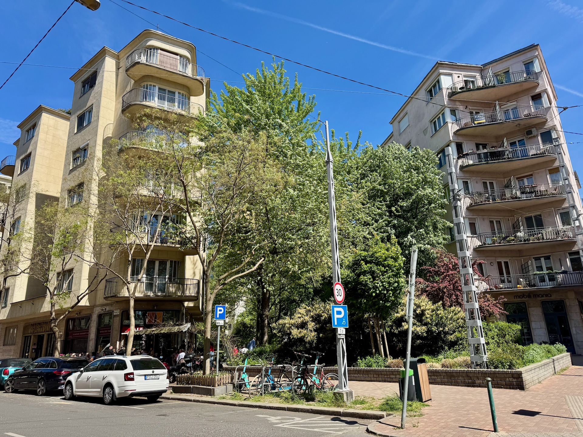 Terrace of Sarki Fűszeres café at the Vasalóház on Pozsonyi út 53–55 Budapest on a sunny spring day