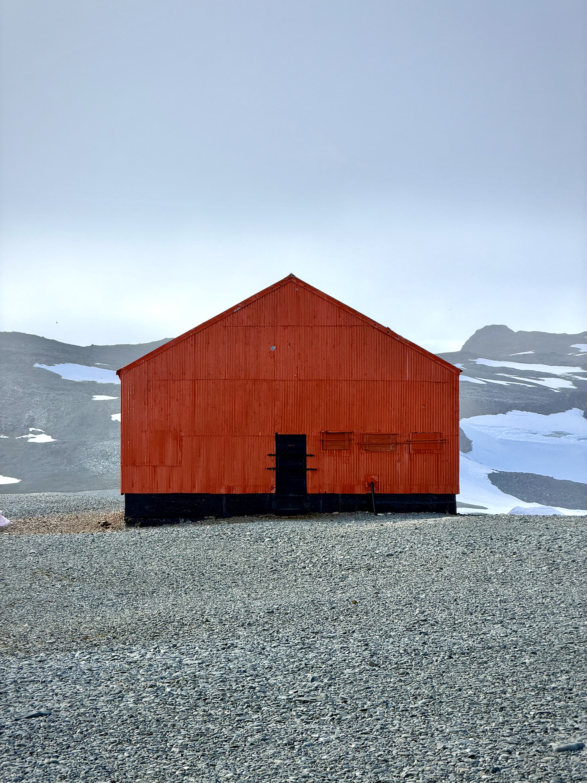 Red exterior of a building at Cámara Station, an Argentine summer research base on Half Moon Island, Antarctica