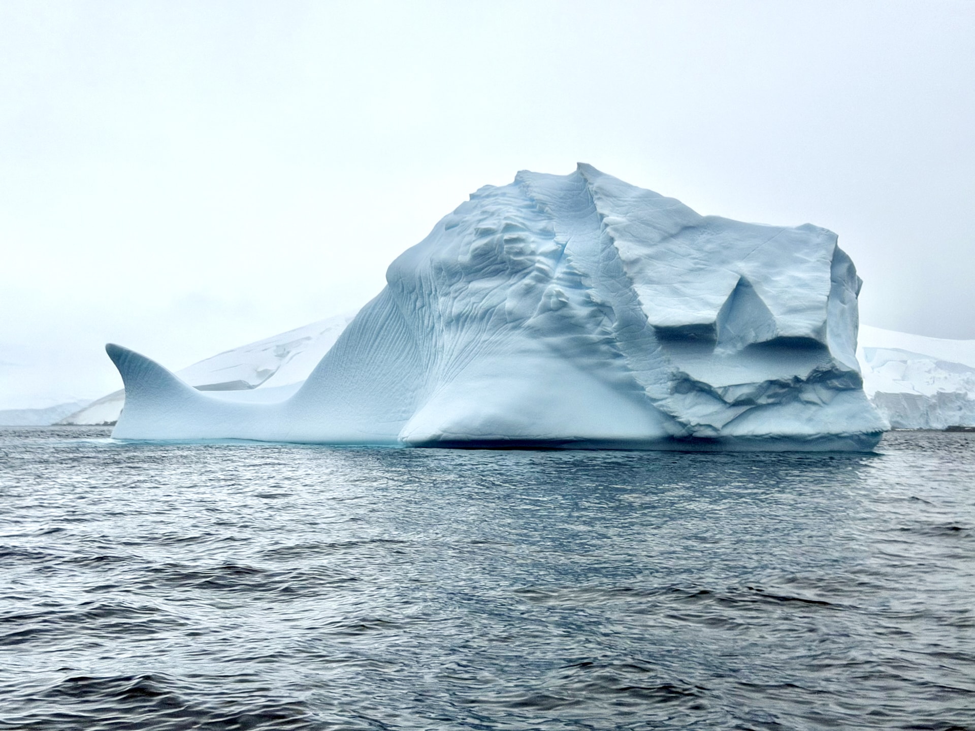 Sculpted, geometric iceberg at Mikkelsen Harbour on the Antarctic Peninsula, photographed from a Zodiac