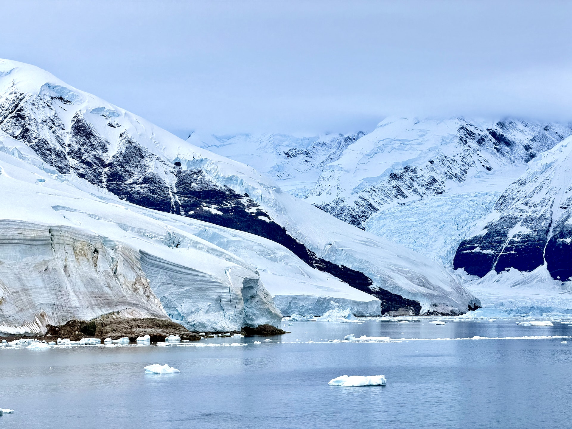 Neko Harbour landing on the Antarctic Peninsula with glacier and dramatic mountain backdrop