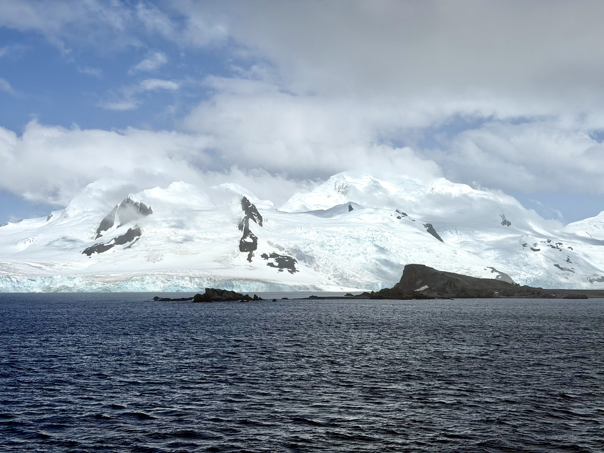 Rocky and icy coastline of the South Shetland Islands in Antarctica