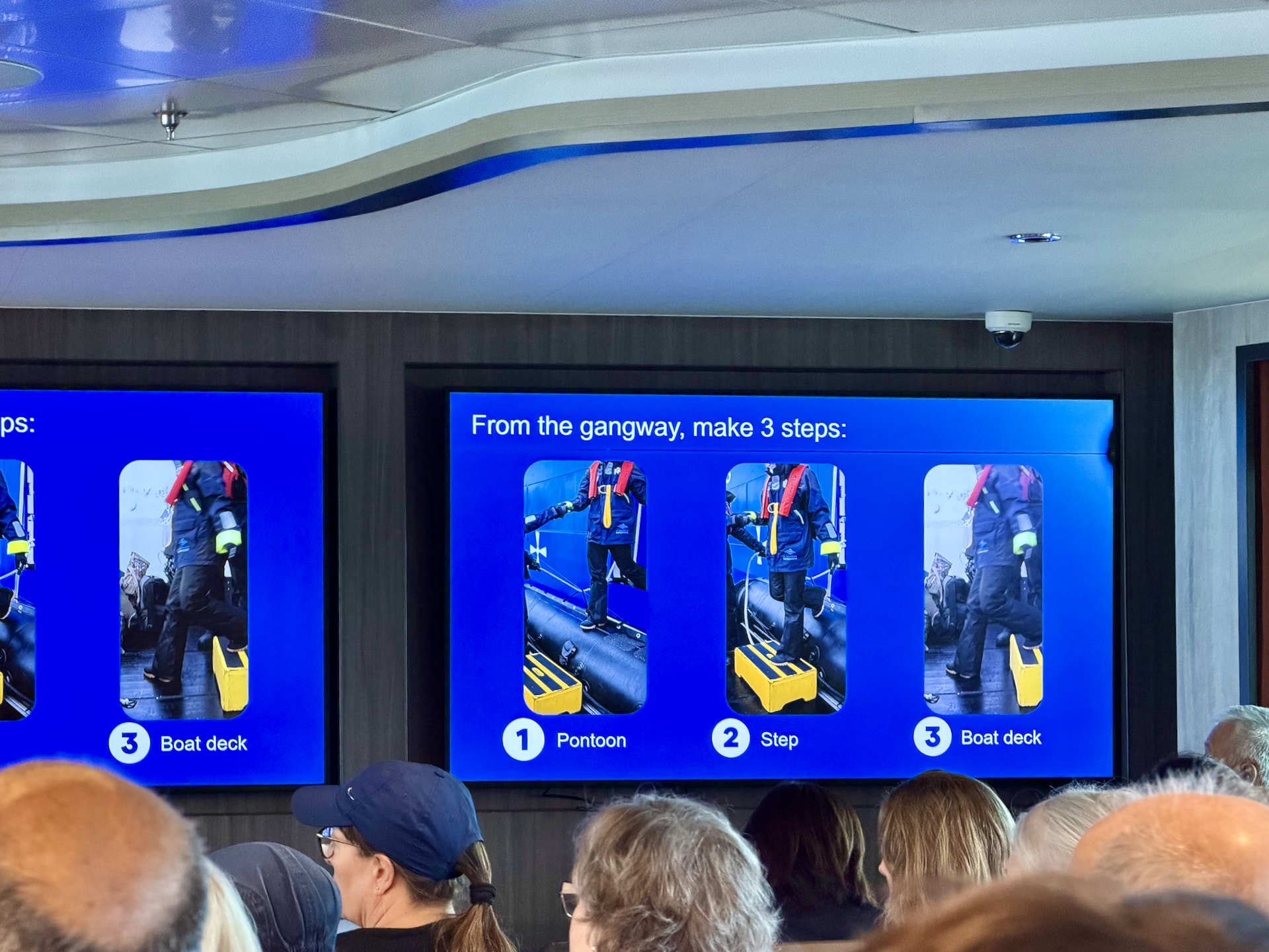 Expedition team briefing on Zodiac boarding technique inside the Ocean Albatros lecture lounge