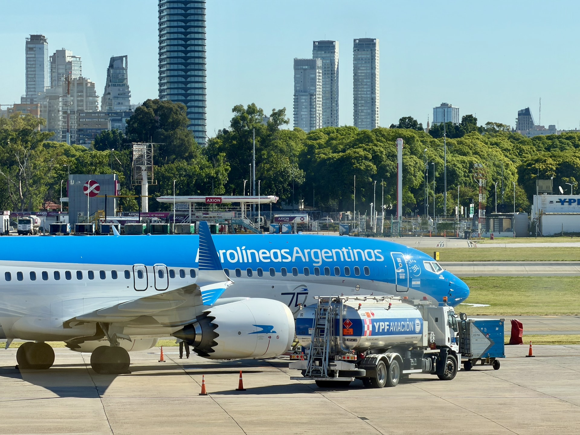 Aerolineas Argentinas Boeing 737 at Buenos Aires Aeroparque Jorge Newbery Aerolineas Argentinas Boeing 737 at Buenos Aires Aeroparque Jorge Newbery with city skyline and YPF fuel truck