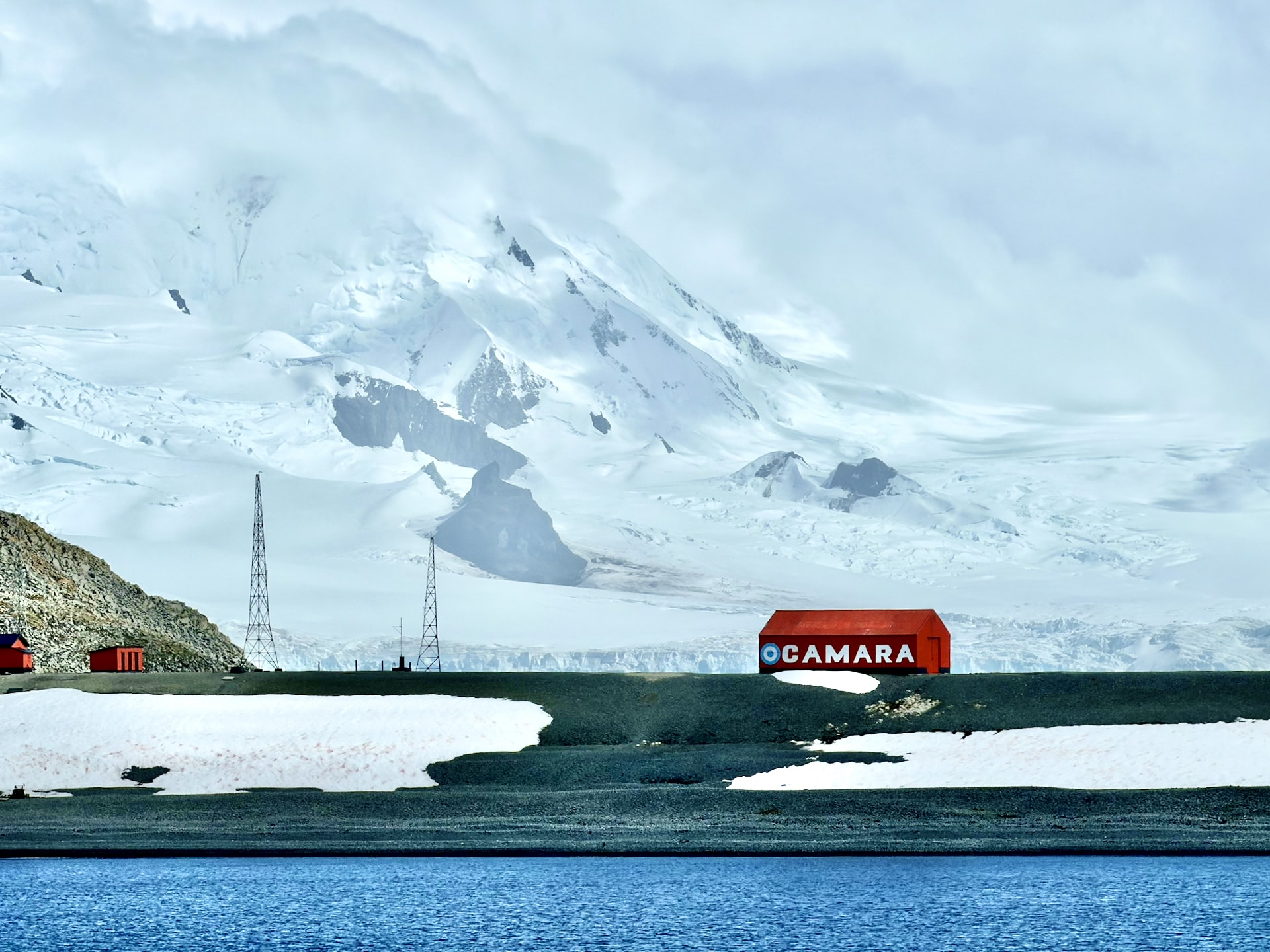 Argentine base Camara Half Moon Island South Shetland Islands Antarctica Argentine Camara Antarctic base with red buildings on Half Moon Island, South Shetland Islands, snow-capped glacier behind