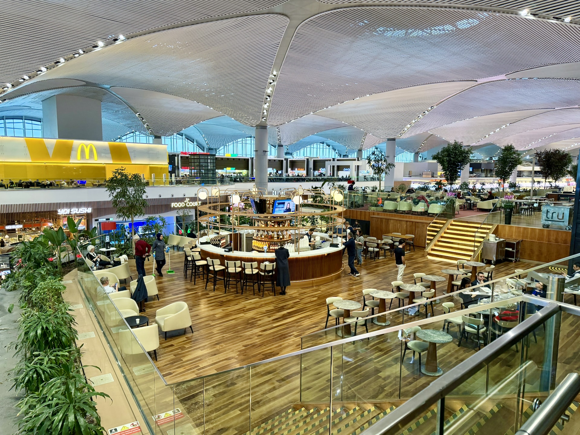 Istanbul Airport IST terminal lounge interior Istanbul Airport IST terminal interior with iconic undulating white ceiling, multi-level food court and lounge area
