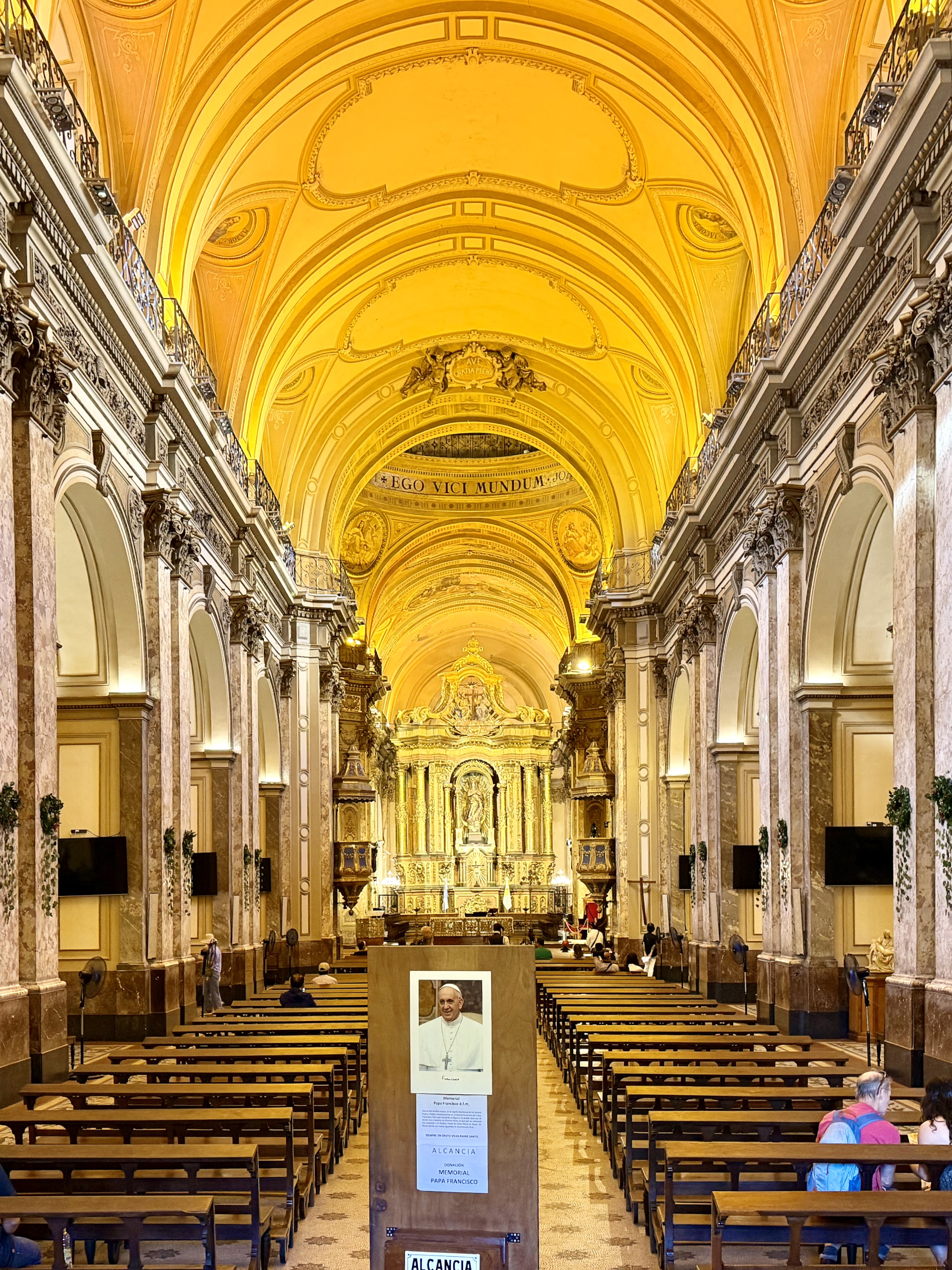 Inside the Metropolitan Cathedral of Buenos Aires The golden, barrel-vaulted nave of the Buenos Aires Metropolitan Cathedral, looking toward the gilded altar.