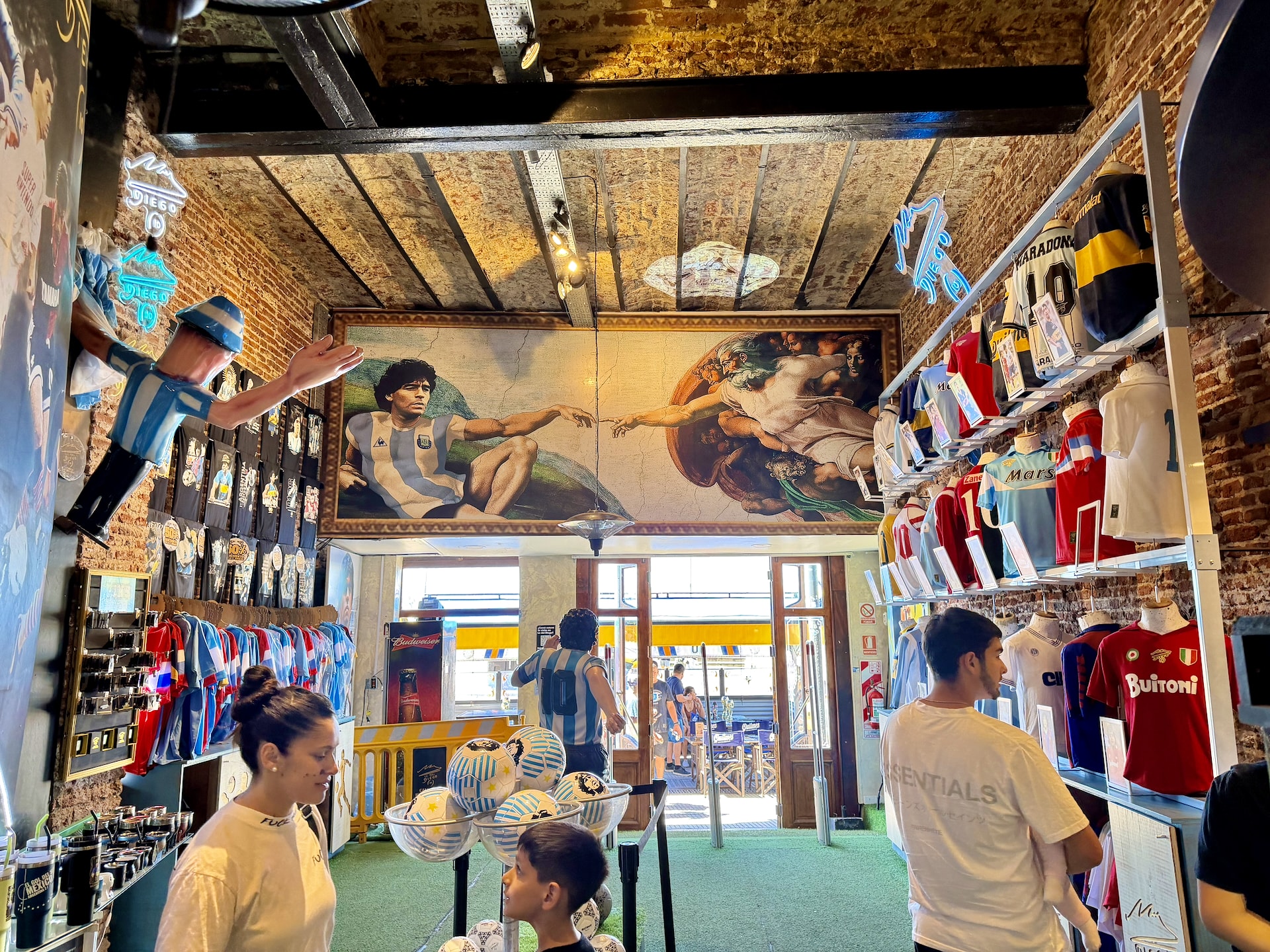 Lo del Diego, a Maradona shrine in La Boca Inside Lo del Diego in La Boca, a Maradona-themed mural styled after Michelangelo's Creation of Adam, football jerseys lining the walls.