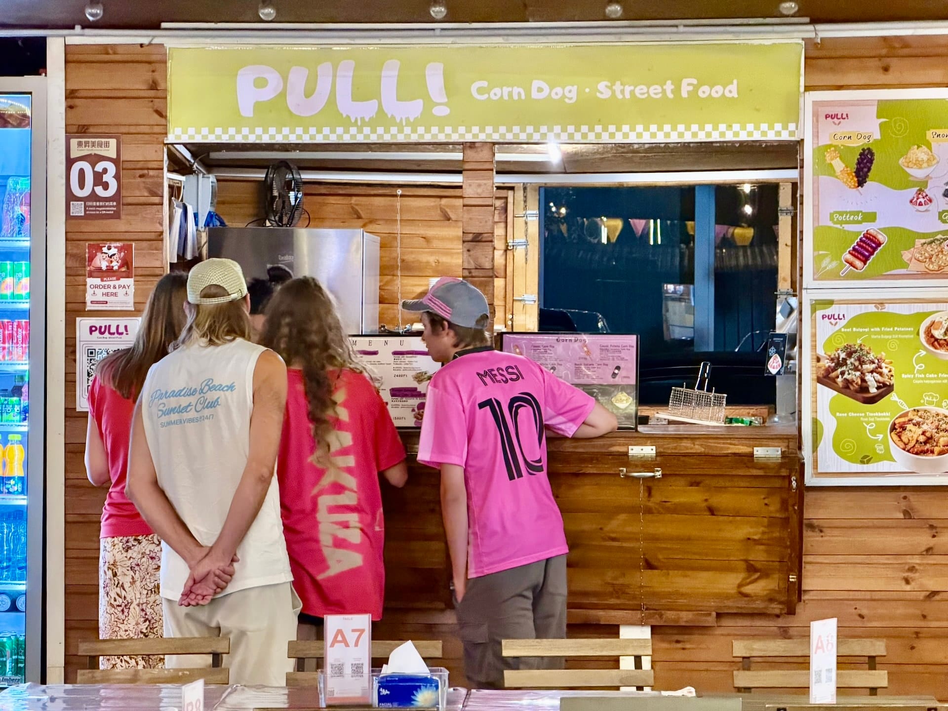 PULL corn dog stall at Bian Garden Budapest Guests ordering at the PULL! corn dog and street food stall at Bian Garden, table number A7 in front
