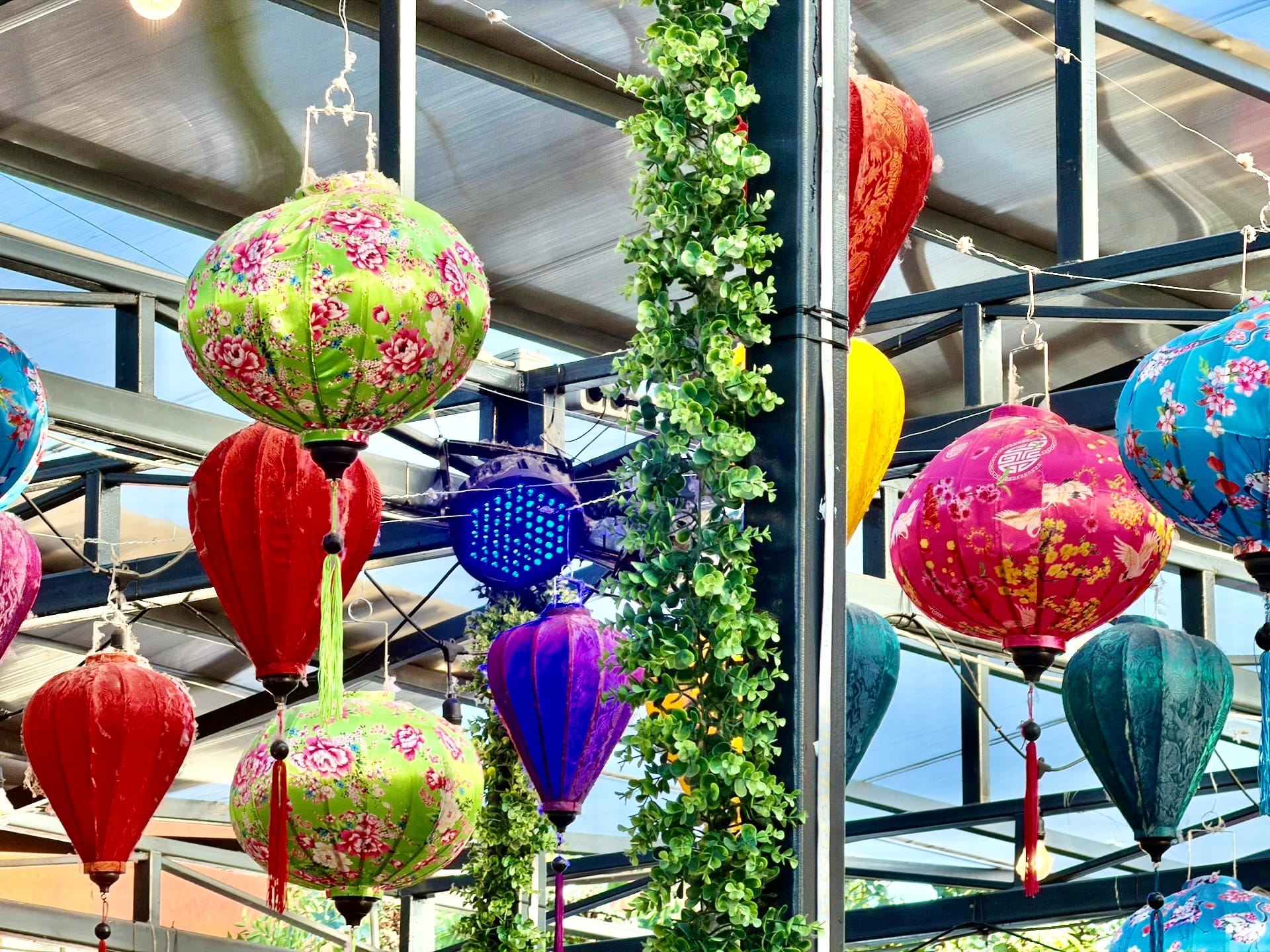 Vietnamese silk lanterns at Bian Garden Budapest Colorful Vietnamese silk lanterns hanging from the steel roof structure at Bian Garden
