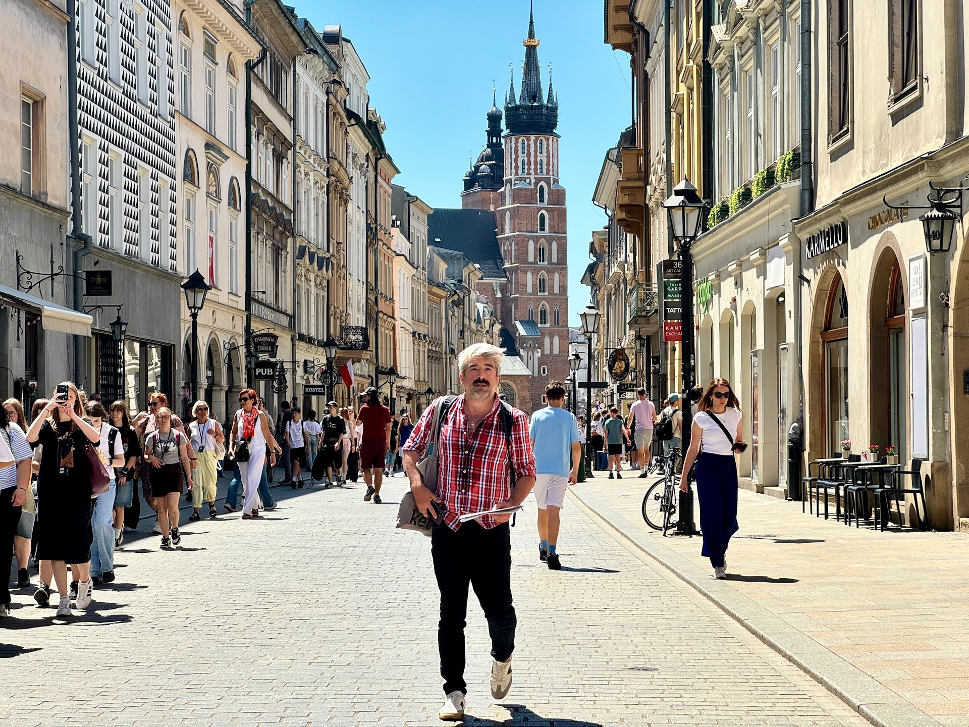 Floriańska street in Krakow's Old Town, St Mary's Basilica tower rising at the far end