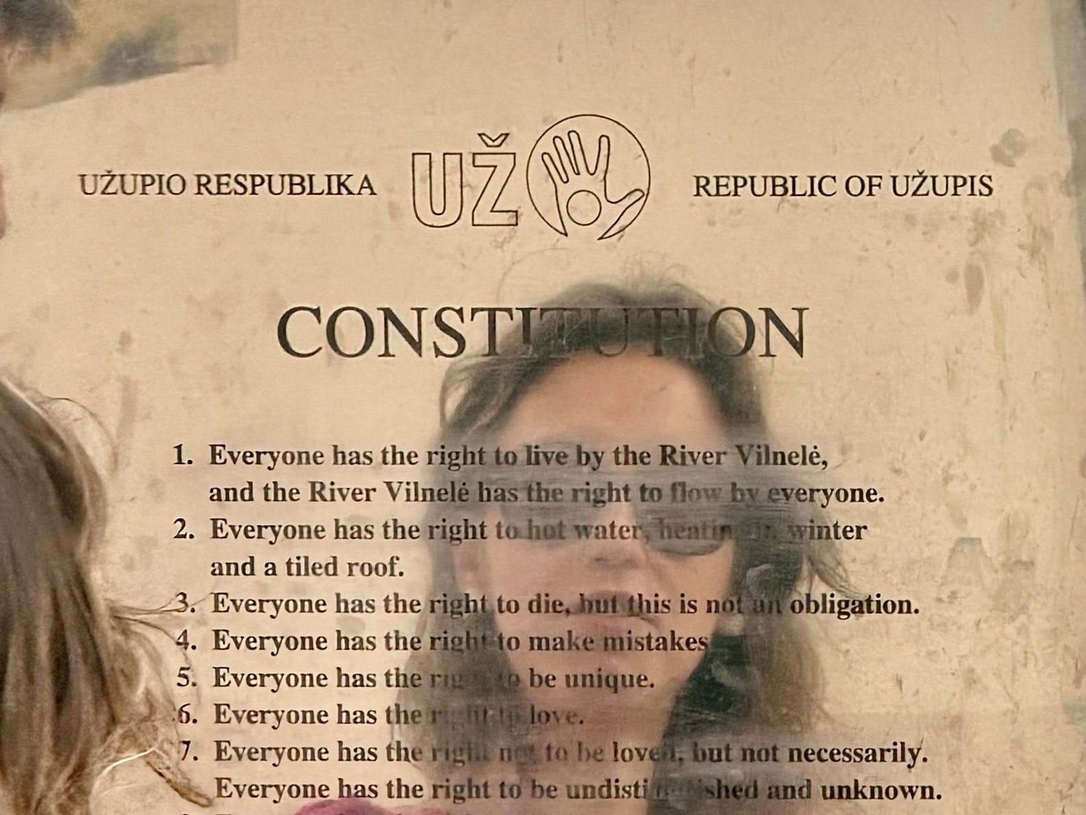 English text of the Užupis constitution Close-up of the English plaque of the Užupis constitution, showing the first articles about the River Vilnelė, hot water and the right to make mistakes.