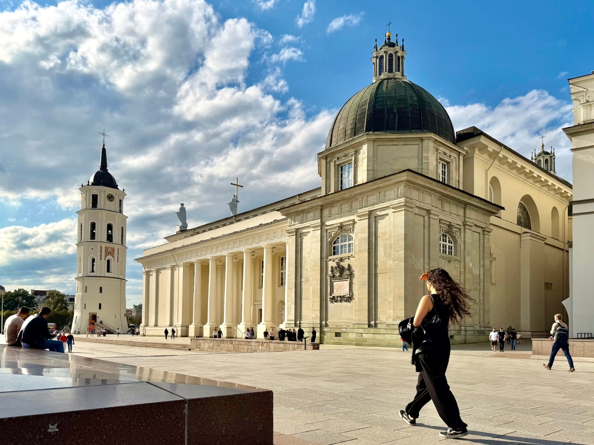 Vilnius Cathedral seen across Cathedral Square Vilnius Cathedral with its portico and green dome, the white bell tower standing apart to the left.