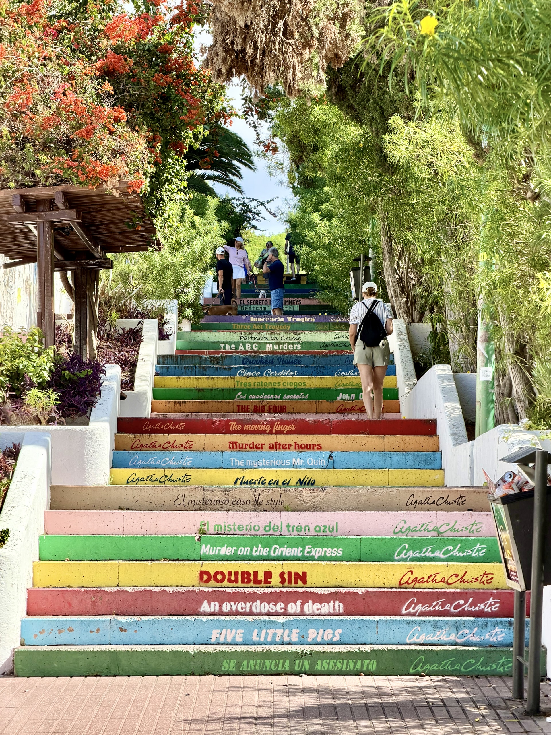 Staircase in Puerto de la Cruz with every step painted a different color and inscribed with an Agatha Christie title