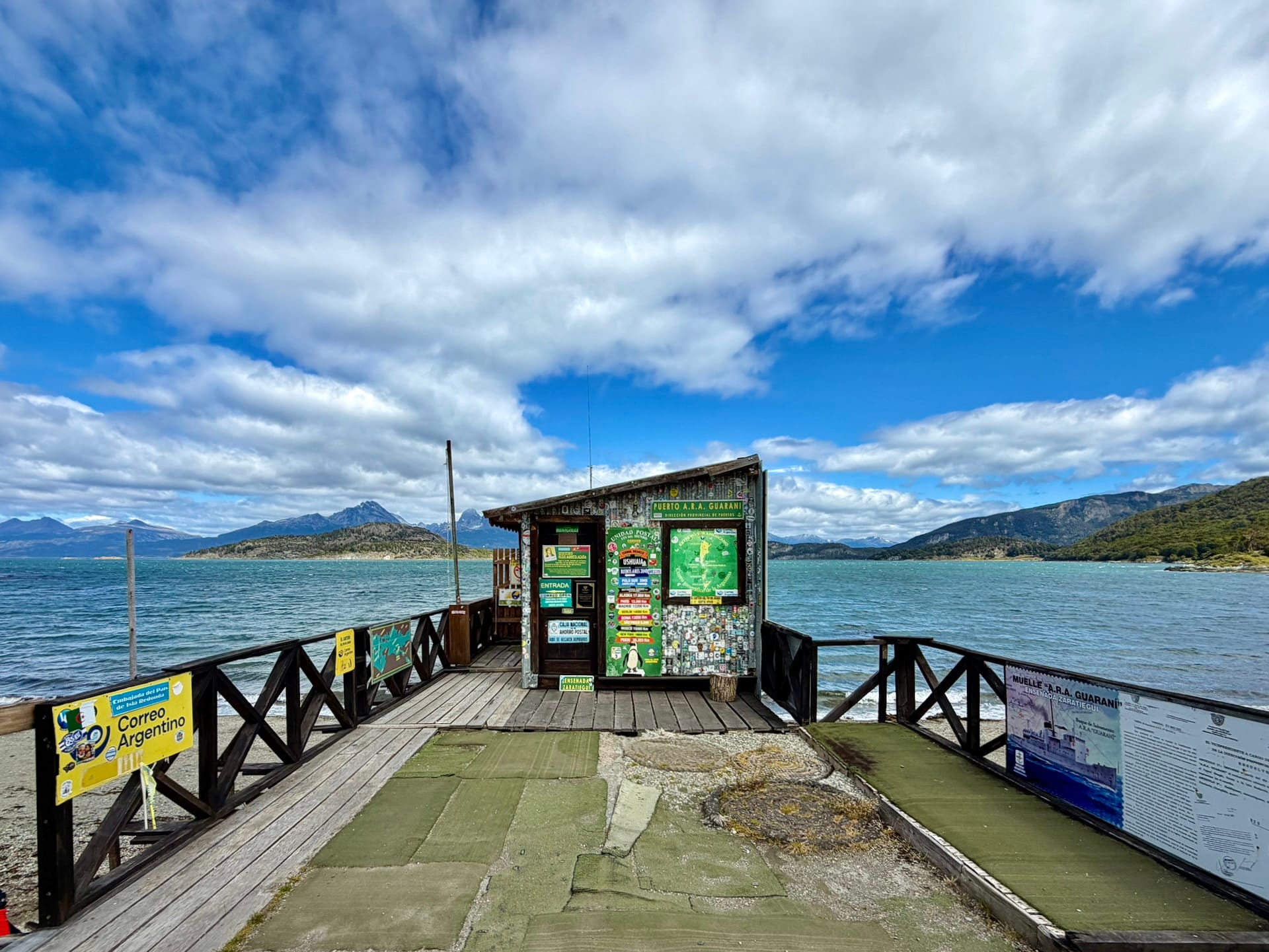 The closed End of the World Post Office hut at the end of a wooden pier on the Beagle Channel